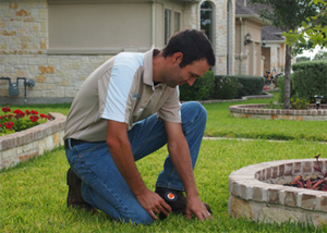 one of our Mira Mesa sprinkler repair techs is fixing a broken head